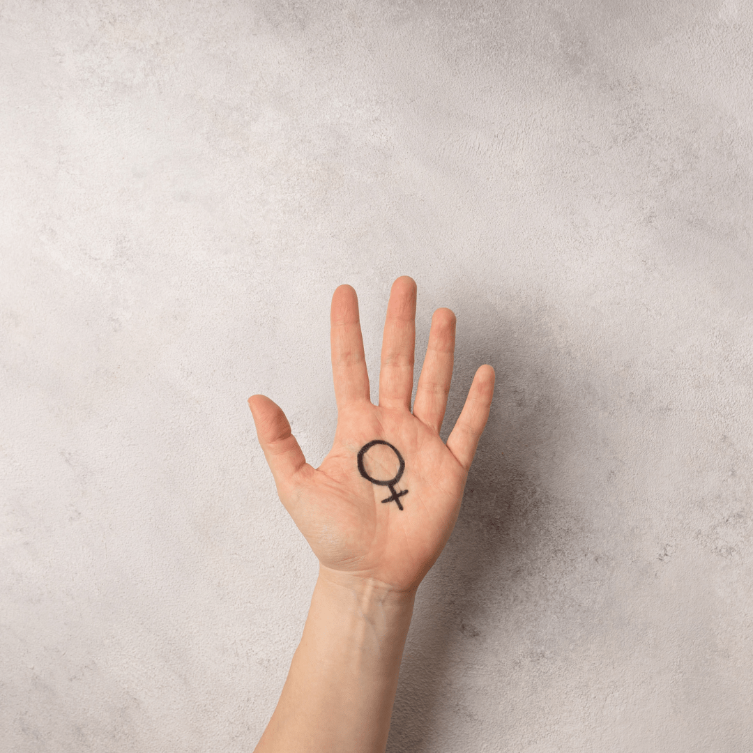 A Woman's Hand With The Female Symbol Drawn On It