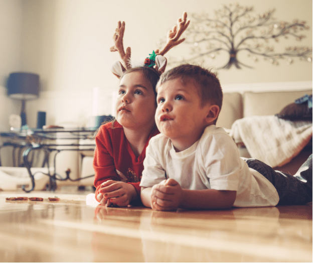 Kids In Christmas Outfits Watching TV